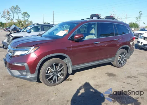 2022 Honda Pilot Awd Touring 7 Passenger z USA, uszkodzony, nr VIN 5FNYF6H61NB000112